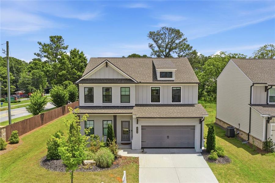 Front exterior of a new home in Westgate Estates, Loganville, GA, highlighting curb appeal (Image 25). Front exterior of a new home in Westgate Estates, Loganville, GA, highlighting curb appeal (Image 25).