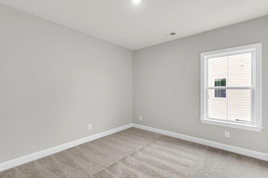 Spacious, unfurnished interior of a new home in Tidewater at Lakes of Cane Bay, Summerville (Image 47).