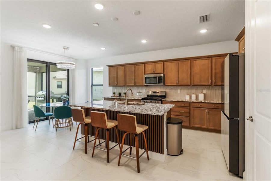 Tons of cabinet space, upgraded appliances, granite countertops