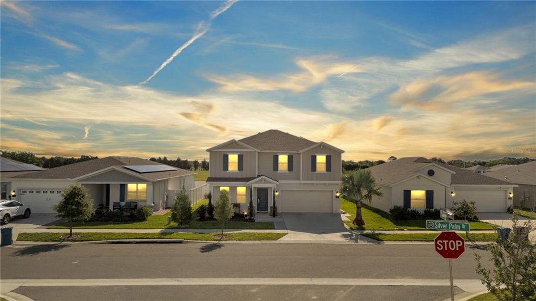 Front exterior of a new home in Cypress Park Estates, Haines City, FL, highlighting curb appeal (Image 24).