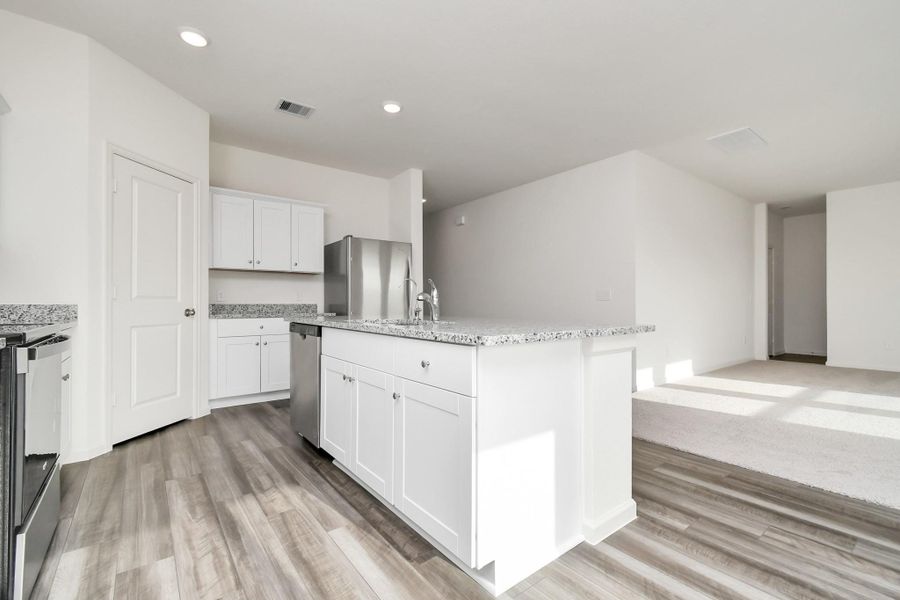 Furnished interior view inside a new home in Sunterra, Katy (Image 13).