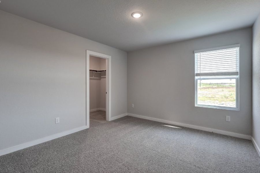 A room with a window and a door.