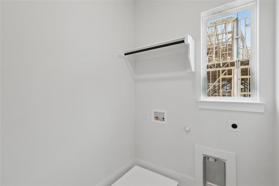 Laundry room with hookup for a gas dryer, hookup for a washing machine, and electric dryer hookup