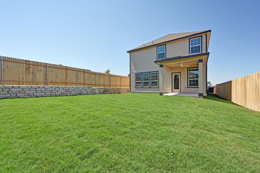 Exterior details and patio area of a home in Creekside at Estancia, Austin (Image 21).