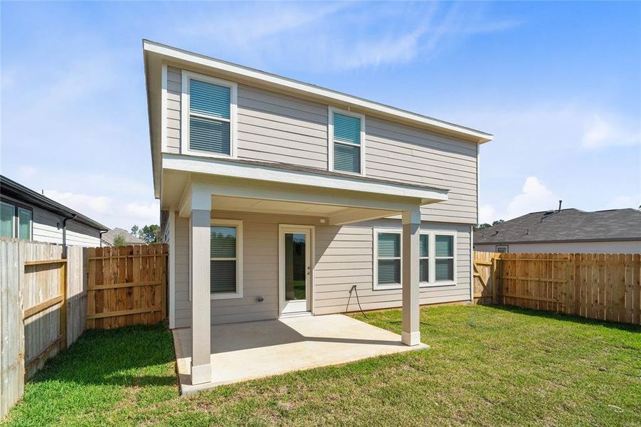 Come and see this spacious backyard with its beautiful covered patio. There is plenty of room for the kids to play and adults to relax!