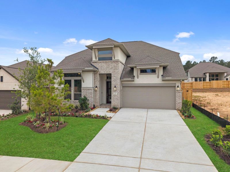 Front exterior of a new home in Wildtree, Magnolia, TX, highlighting curb appeal (Image 17).