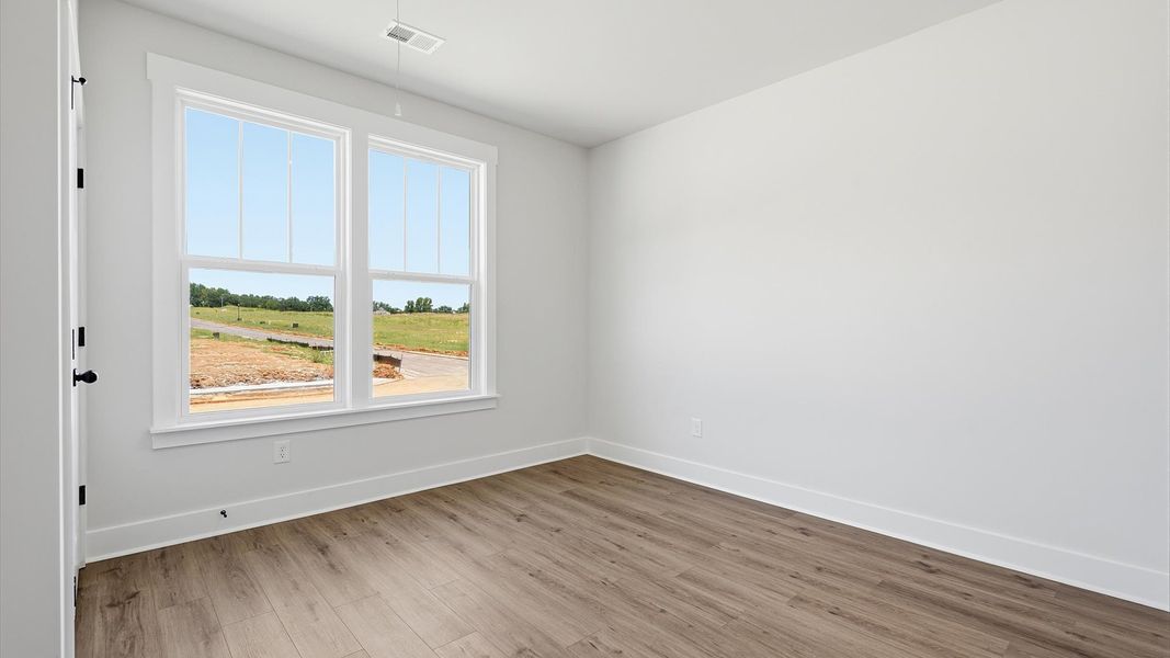 Thoughtfully designed secondary bedrooms featuring hardwood flooring and tasteful detail Thoughtfully designed secondary bedrooms featuring hardwood flooring and tasteful detail