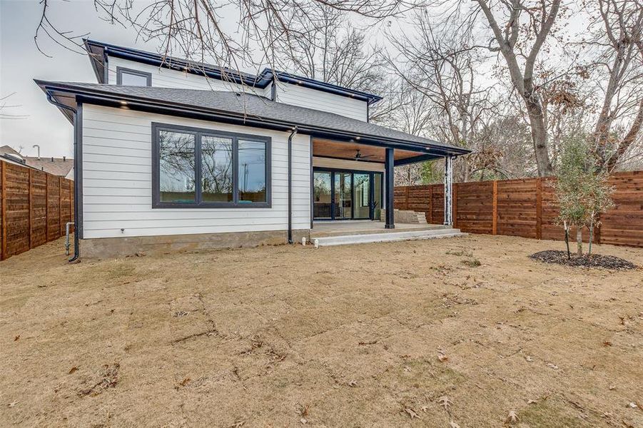 Rear view of house featuring a patio and ceiling fan