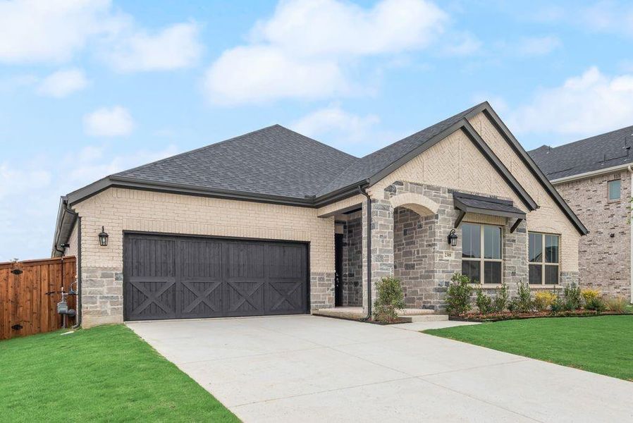 Front exterior of a new home in Valencia On The Lake, Little Elm, TX, highlighting curb appeal (Image 21).