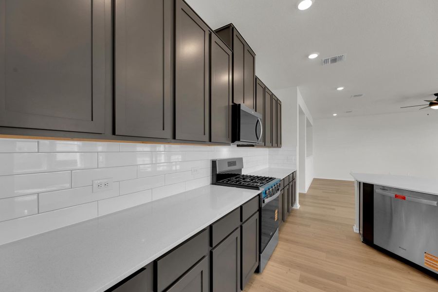 Furnished interior view inside a new home in Salerno - Classic Collection, Round Rock (Image 8). Furnished interior view inside a new home in Salerno - Classic Collection, Round Rock (Image 8).