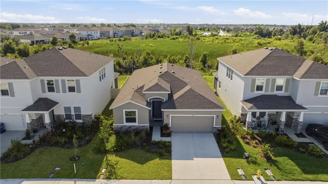 Front exterior of a new home in Bella Lago, Parrish, FL, highlighting curb appeal (Image 2). Front exterior of a new home in Bella Lago, Parrish, FL, highlighting curb appeal (Image 2).
