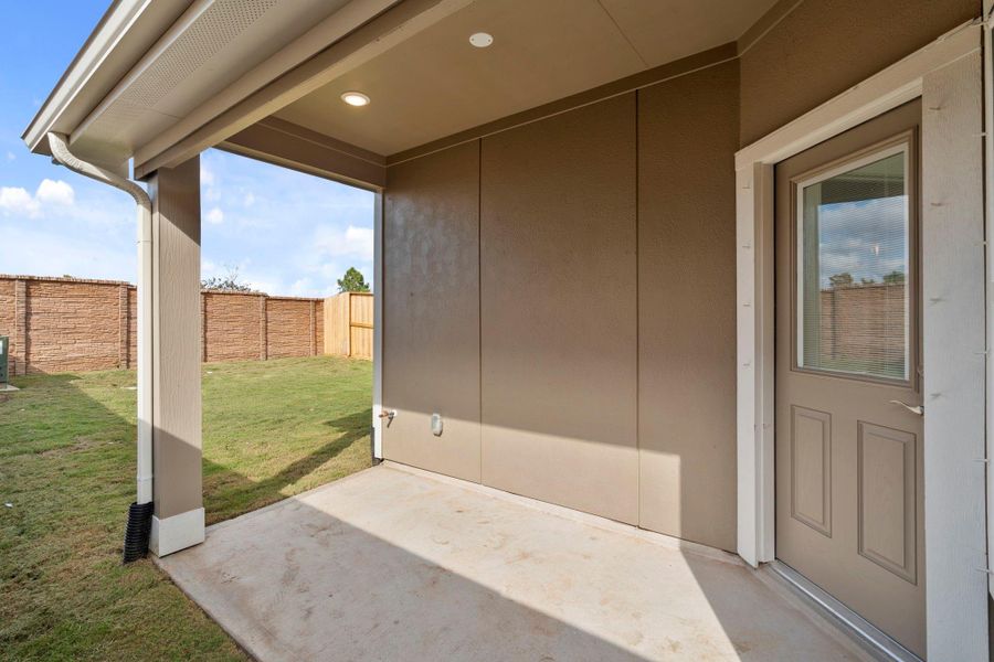 Exterior details and patio area of a home in Meridiana, Iowa Colony (Image 3).