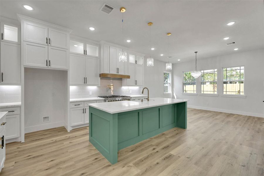 Kitchen with quartz countertops and custom cabinetry Kitchen with quartz countertops and custom cabinetry