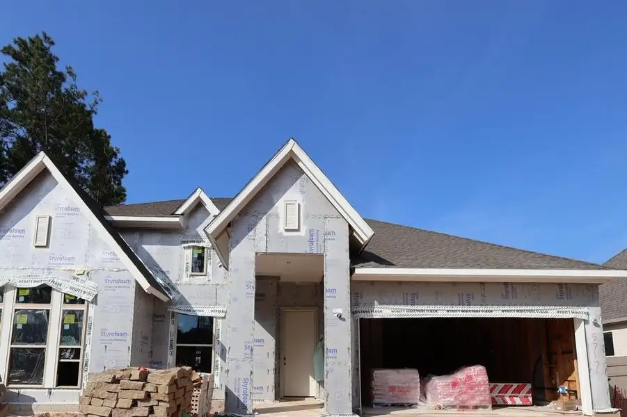 Front exterior of a new home in ARTAVIA 65' Homesites, Conroe, TX, highlighting curb appeal (Image 1). Front exterior of a new home in ARTAVIA 65' Homesites, Conroe, TX, highlighting curb appeal (Image 1).