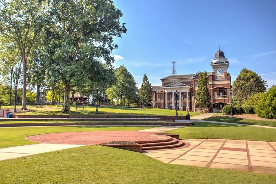 Front exterior of a new home in Riversong, Duluth, GA, highlighting curb appeal (Image 17).