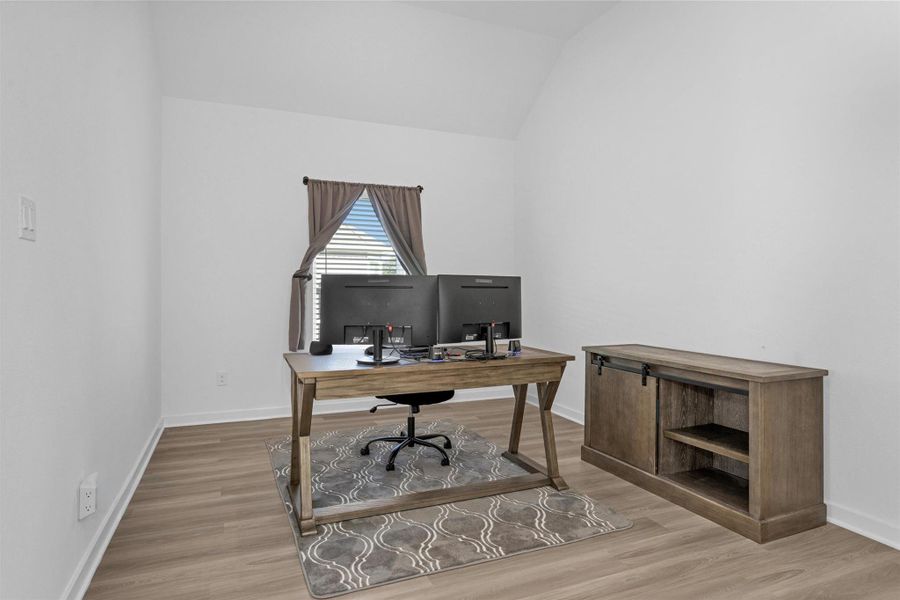 This versatile room is ideal for dining, a home office, or a quiet study for remote work and everyday living.