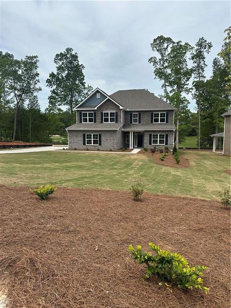 Front exterior of a new home in , Villa Rica, GA, highlighting curb appeal (Image 16). Front exterior of a new home in , Villa Rica, GA, highlighting curb appeal (Image 16).