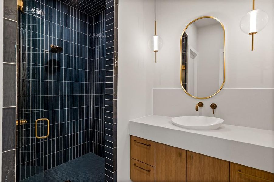 Full bathroom with a stall shower and vanity Full bathroom with a stall shower and vanity