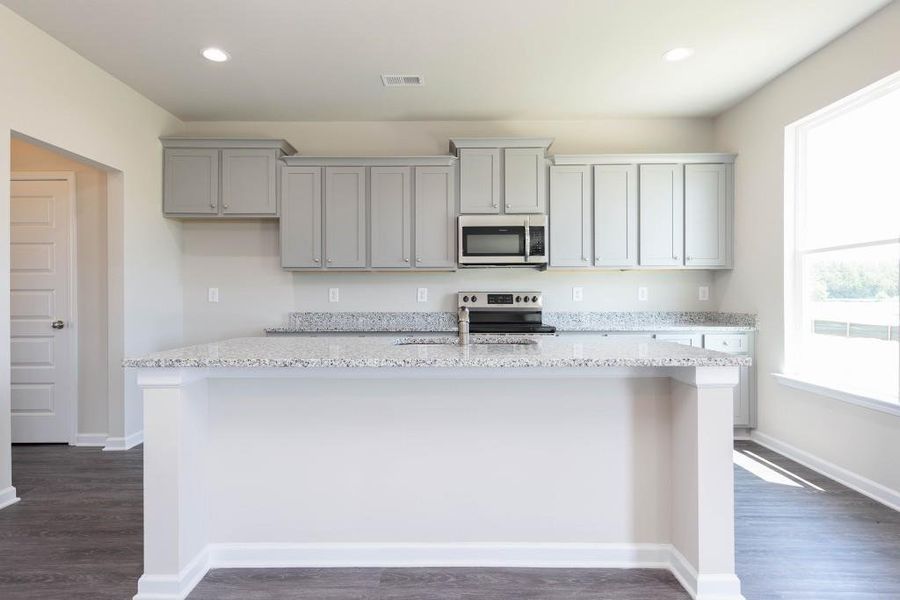 Furnished interior view inside a new home in Sutton's Landing, Statham (Image 5).