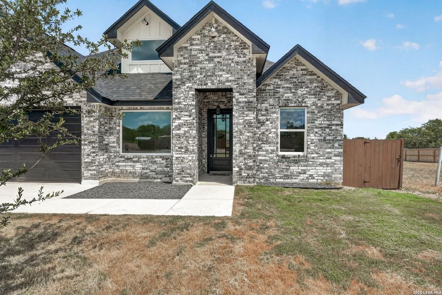 Front exterior of a new home in , Somerset, TX, highlighting curb appeal (Image 24).
