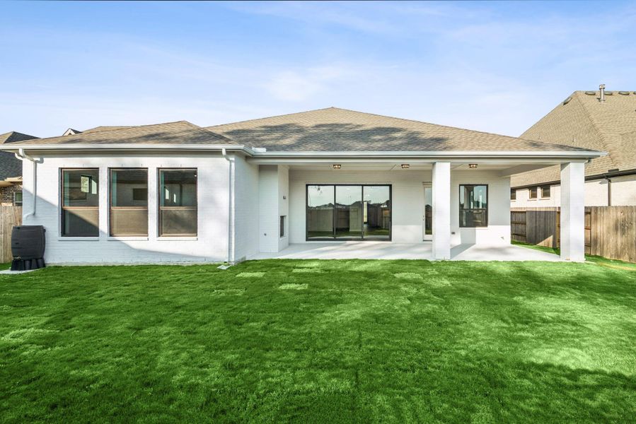 Exterior details and patio area of a home in ARTAVIA - Parkview Collection, Conroe (Image 26).