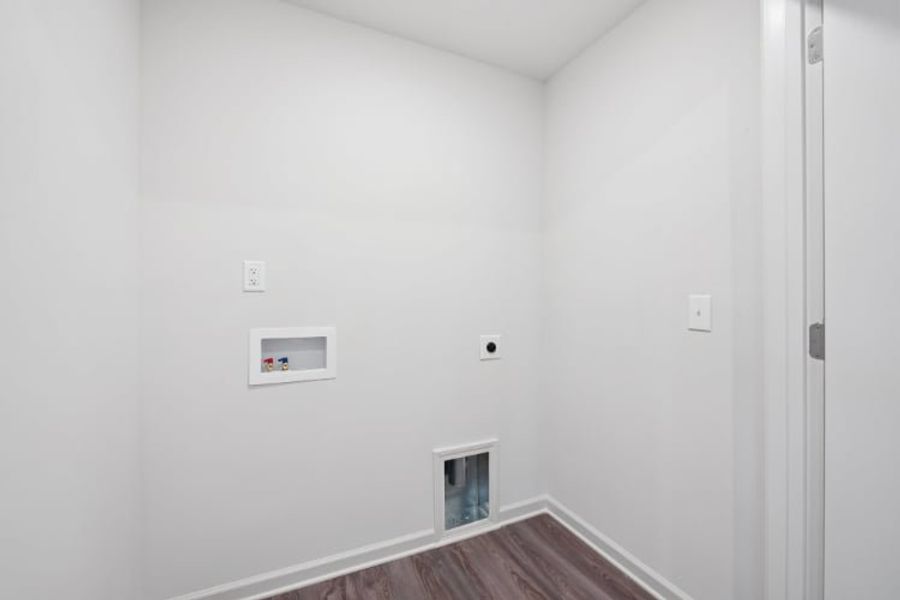 A hallway with white walls.