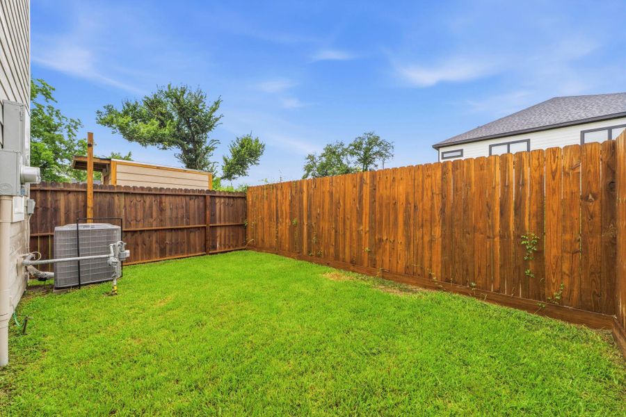 Fully fenced backyard ready for pets, play, and gardening.