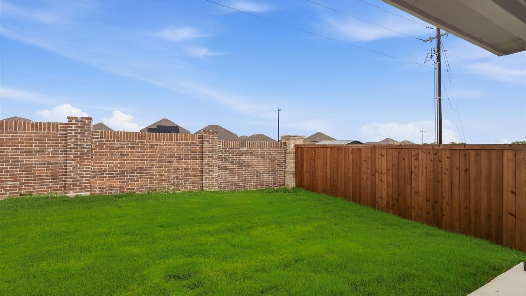 Exterior details and patio area of a home in Westridge Journey, Princeton (Image 27).
