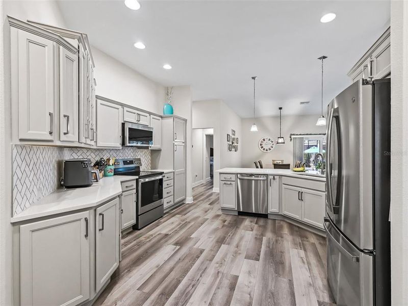 Kitchen with quartz counter tops and Marble backsplash in herringbone pattern