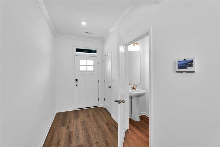 This entry features sleek flooring and leads to a This entry features sleek flooring and leads to a