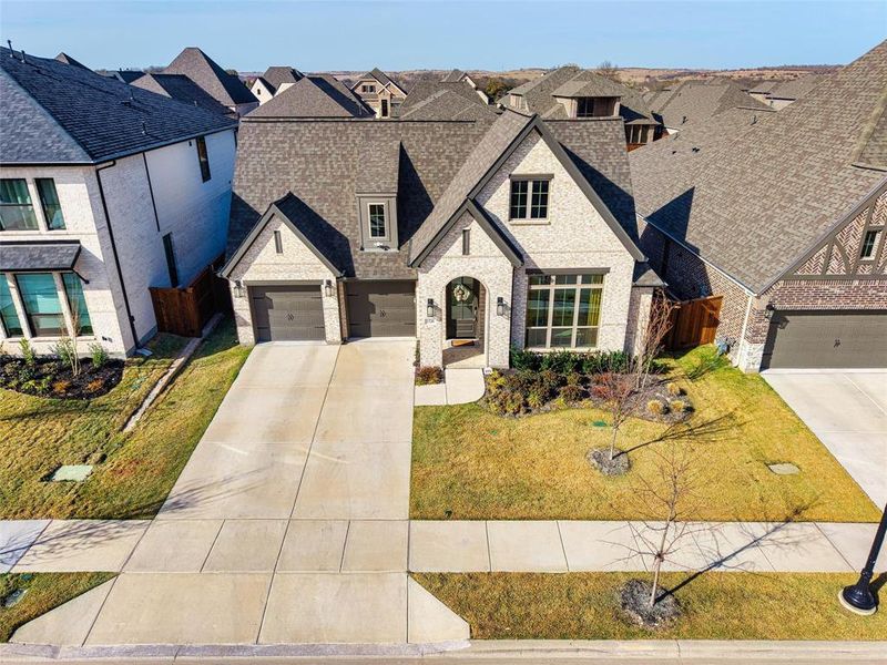 Front exterior of a new home in Walsh, Fort Worth, TX, highlighting curb appeal (Image 26).