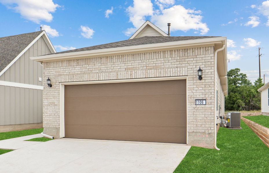 Front exterior of a new home in Sun City Texas, Georgetown, TX, highlighting curb appeal (Image 18).