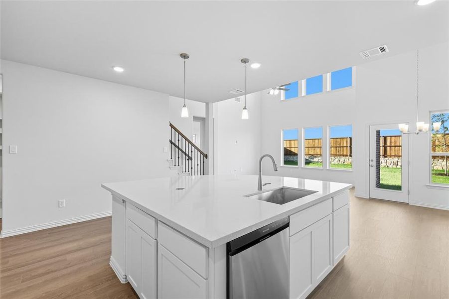 Kitchen featuring white cabinetry, dishwasher, recessed lighting, light wood-style flooring, and pendant lighting Kitchen featuring white cabinetry, dishwasher, recessed lighting, light wood-style flooring, and pendant lighting