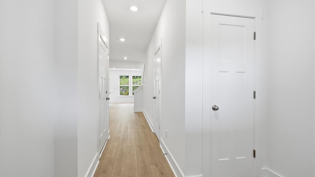 Refined foyer with hardwood floors and thoughtful design for a first-rate welcome Refined foyer with hardwood floors and thoughtful design for a first-rate welcome