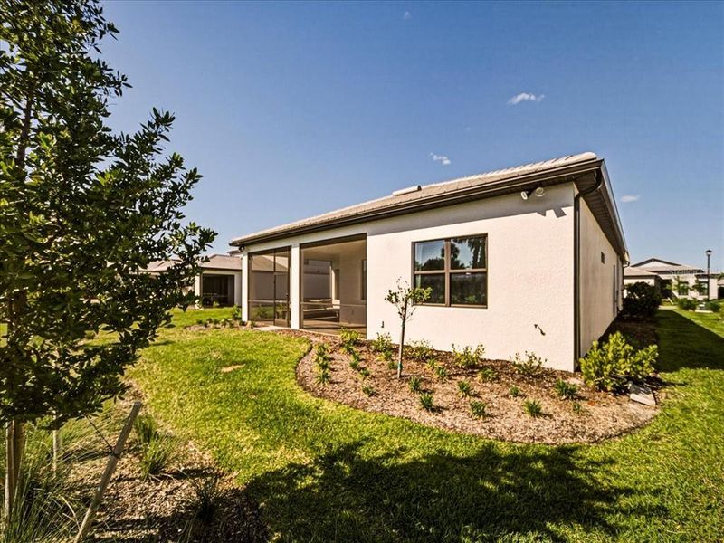 Exterior details and patio area of a home in Talon Preserve on Palmer Ranch, Nokomis (Image 31).