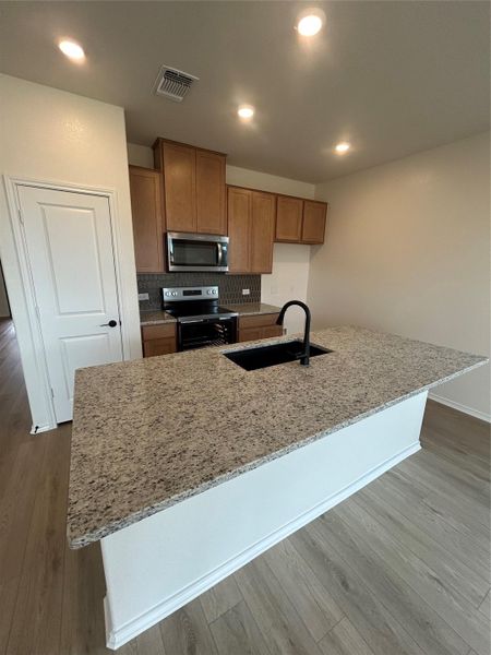 Furnished interior view inside a new home in Mustang Valley, Manor (Image 7).