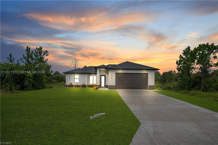 Front exterior of a new home in , Lehigh Acres, FL, highlighting curb appeal (Image 2). Front exterior of a new home in , Lehigh Acres, FL, highlighting curb appeal (Image 2).