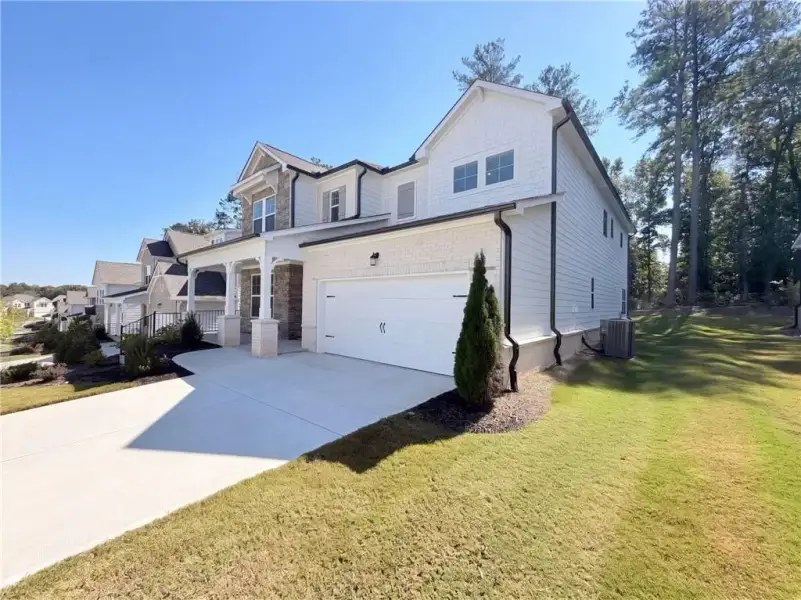 Front exterior of a new home in Bailey Fence, Dacula, GA, highlighting curb appeal (Image 2). Front exterior of a new home in Bailey Fence, Dacula, GA, highlighting curb appeal (Image 2).