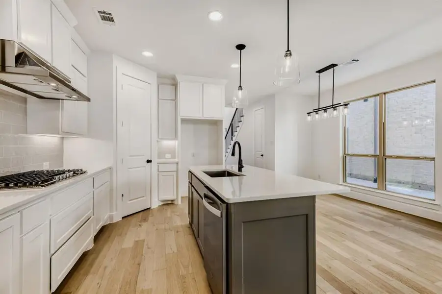 Furnished interior view inside a new home in Castle Hills Northpointe - Townhomes, Lewisville (Image 13).