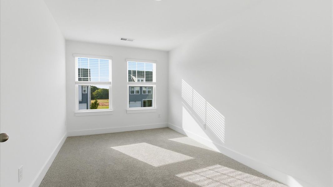 Vibrant and restful bedroom with oversized windows, refined detail, and a warm, welcoming atmosphere at Silo Ridge
