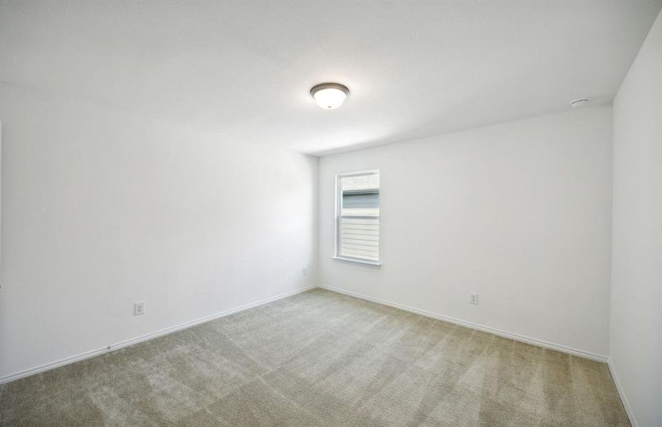 Spacious secondary bedroom with ample closet space*real home pictured