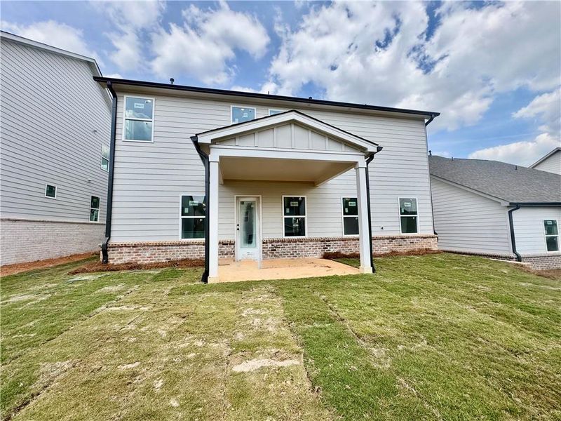 Exterior details and patio area of a home in Eastlyn Crossing, Flowery Branch (Image 4).