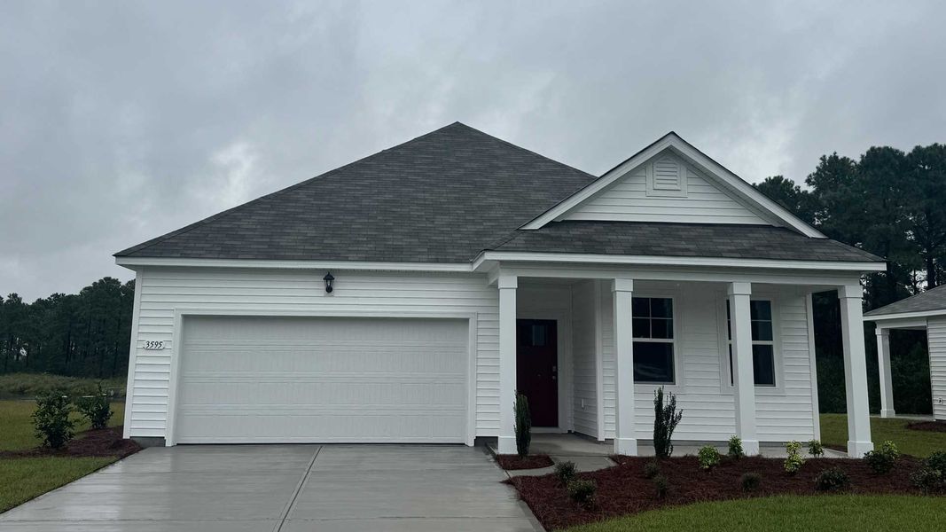 Front exterior of a new home in Ridgefield, Conway, SC, highlighting curb appeal (Image 1).