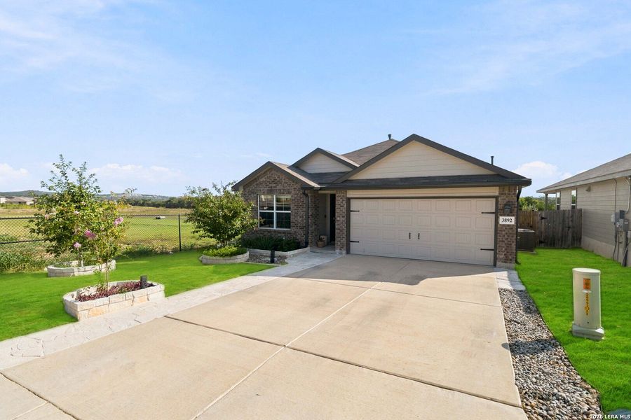 Front exterior of a new home in Copper Canyon, Bulverde, TX, highlighting curb appeal (Image 23).