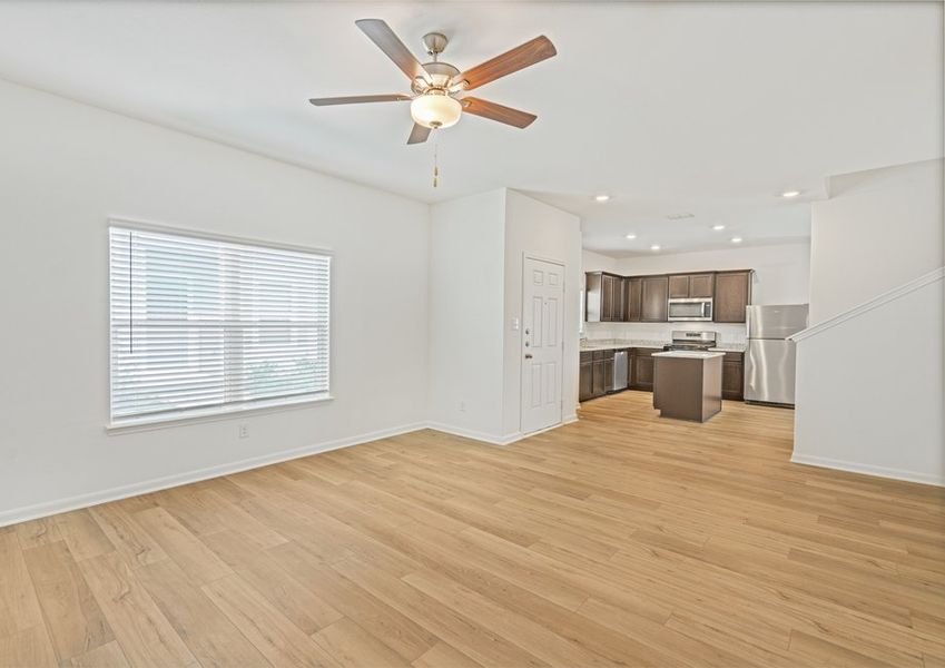 Open layout of the main floor with a large living room and chef-ready kitchen. Open layout of the main floor with a large living room and chef-ready kitchen.
