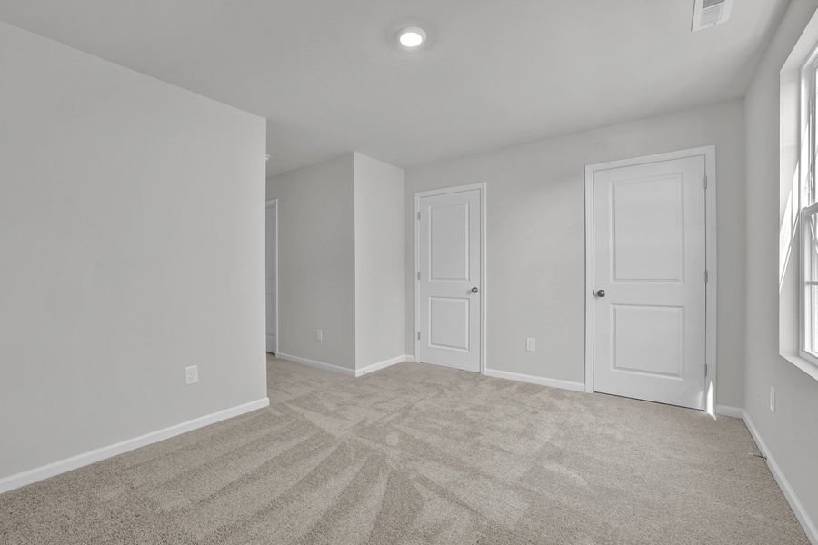 Spacious, unfurnished interior of a new home in River Tide Farms, Bolivia (Image 27).