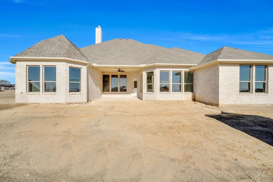 Rear view of house with ceiling fan