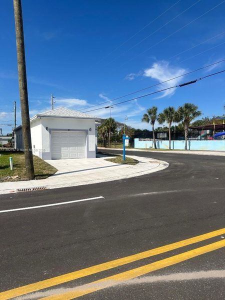 Front exterior of a new home in , Boynton Beach, FL, highlighting curb appeal (Image 22).