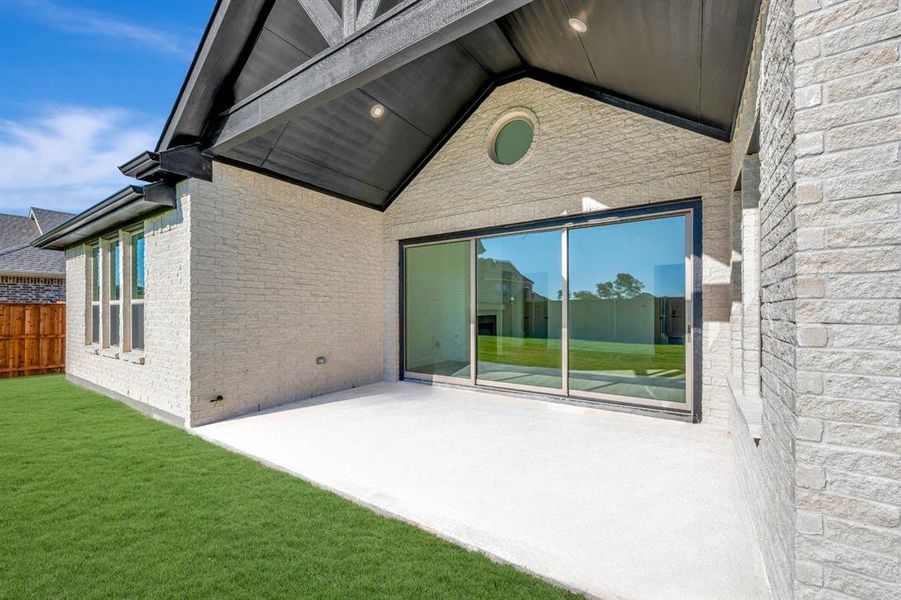 Exterior details and patio area of a home in Kreymer at the Park, Wylie (Image 24).