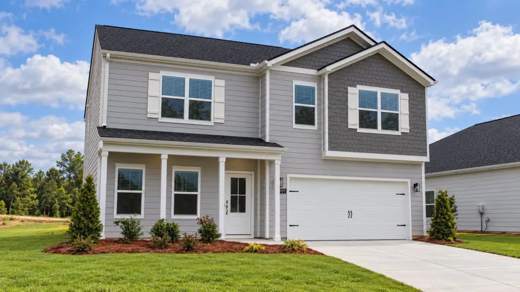 Front exterior of a new home in The Hideaway at Edgestone, Ooltewah, TN, highlighting curb appeal (Image 2).